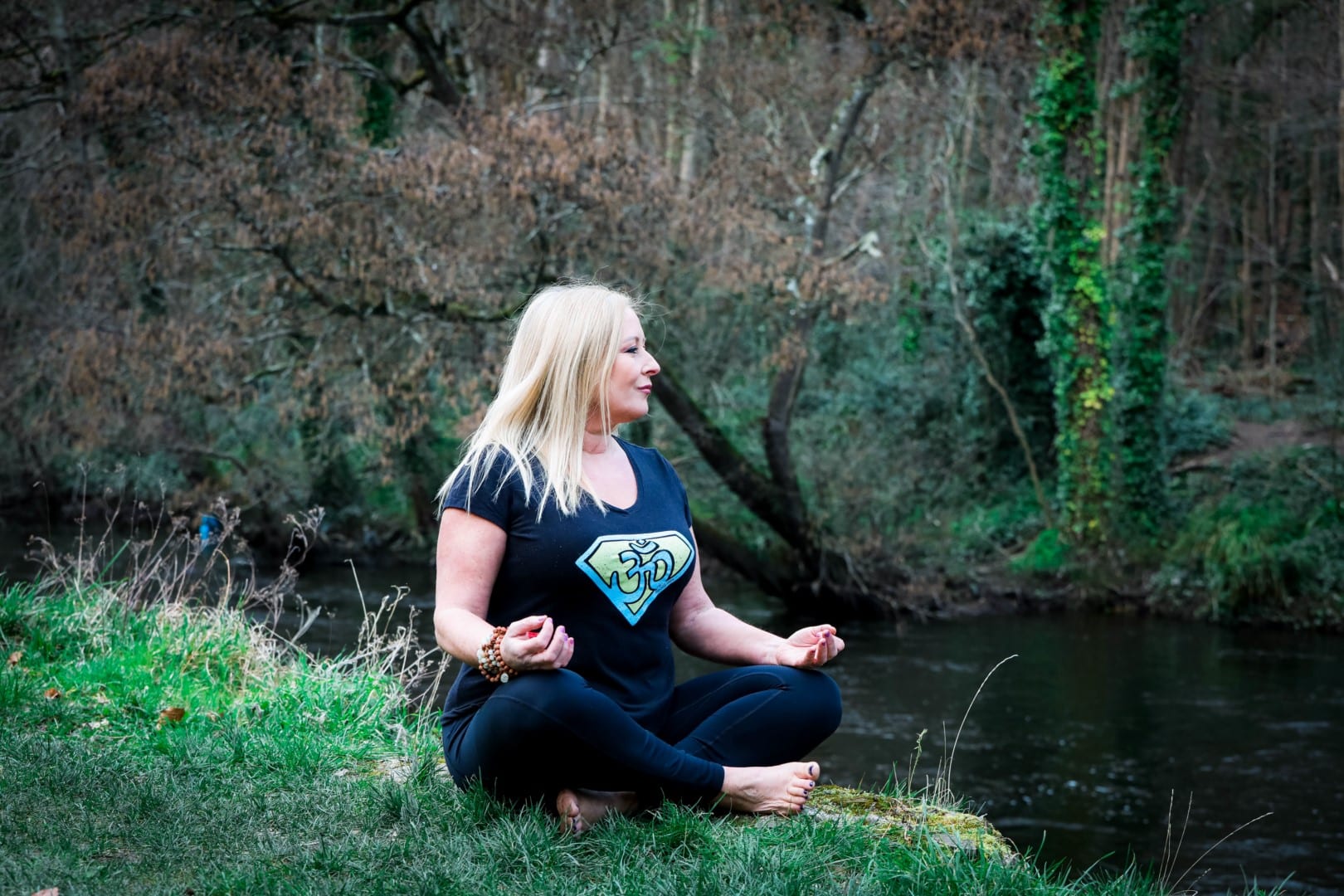 Anna Teague yoga pose by the river, image 2